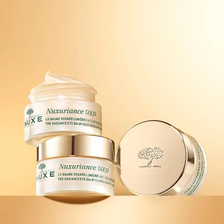Set Nuxe Nuxuriance Gold, balsam de ochi iluminator, piele uscată, 2 x 15 ml + geantă cosmetică gratuită