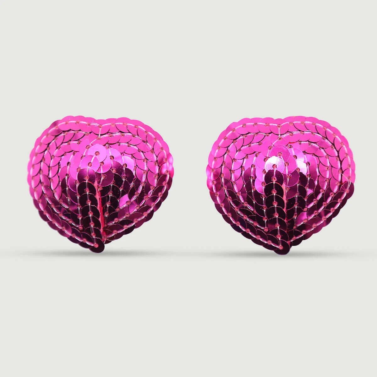 Hartvormige tepelpasteitjes met lovertjes - Fuchsia